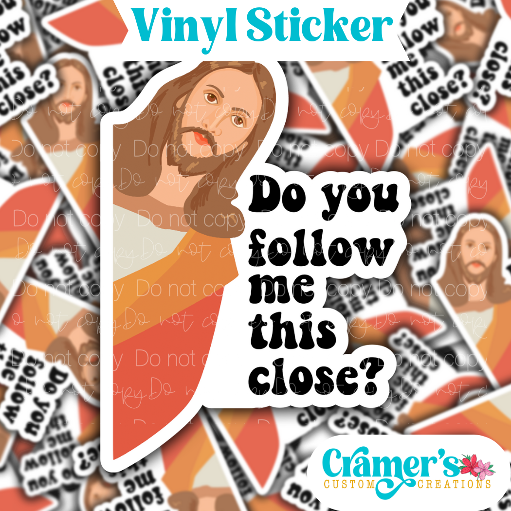 Sticker laying flat that says dok you follow me this close with jesus peaking on a background of the same sticker stacked up