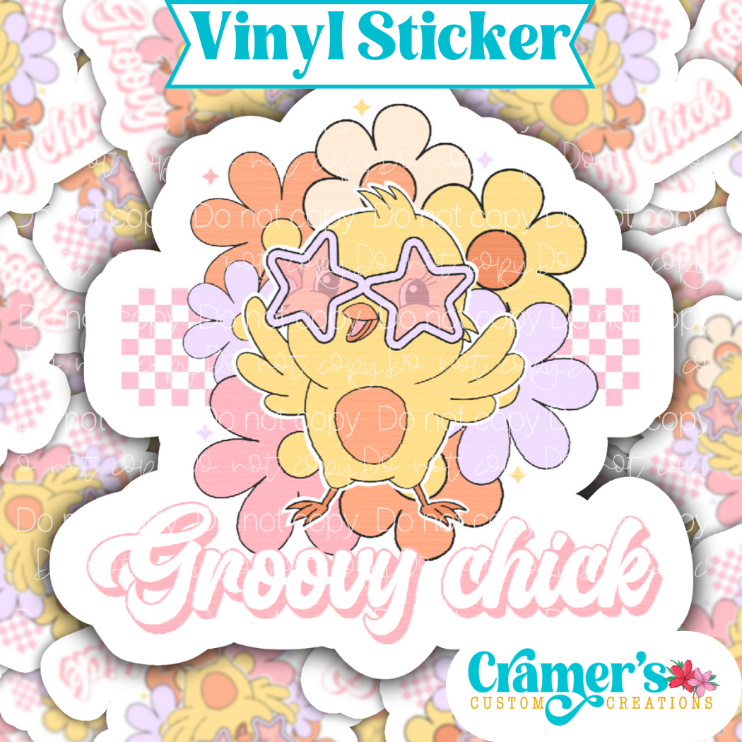 A vinyl sticker with a groovy chick design, featuring a yellow chick with star sunglasses, surrounded by floral patterns.