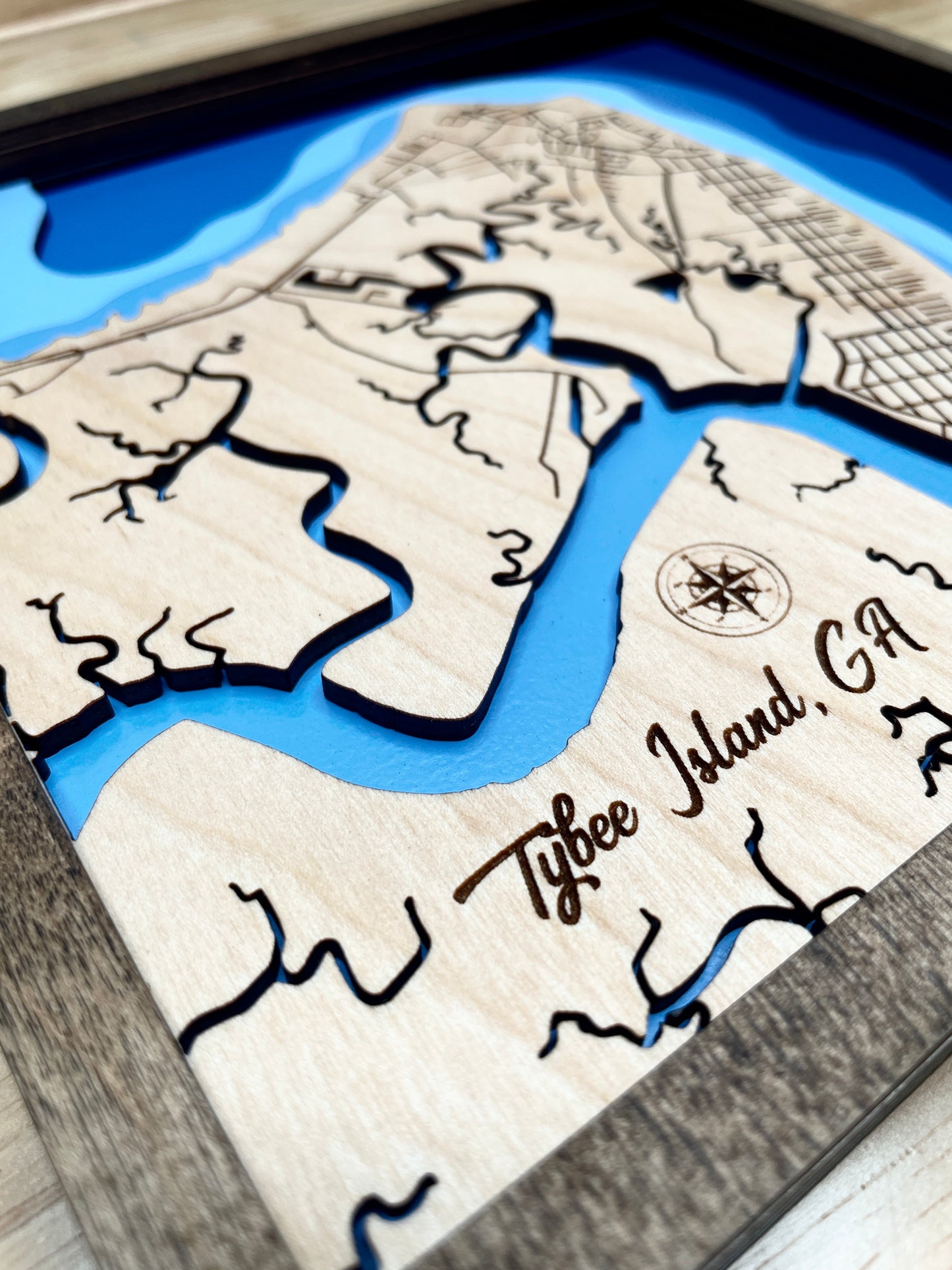 One view of a wood bathymetric map showing water ways of tybee, painted with to show depth