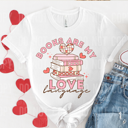a white shirt laying fat that says books are my love language