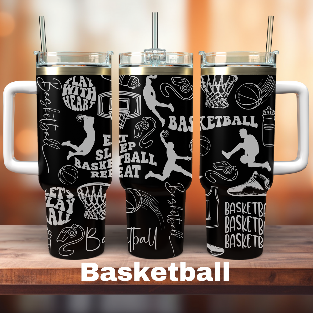 Three 40 oz black tumblers with laser engraved basketball designs and text, placed on a wooden surface with a blurred background.