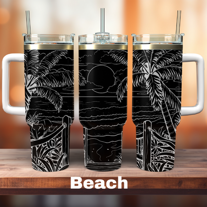 three 40oz black tumblers with a beach scene the whole way around