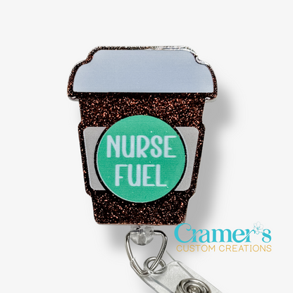 Badge holder shaped like a coffee cup with 'Nurse Fuel' text on a white background, featuring the brand 'Gramer's Custom Creations'.