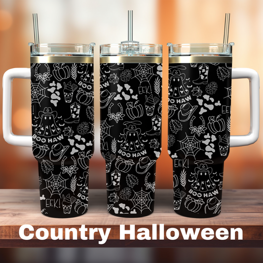 Three black 40 oz tumblers with white laser engraved designs featuring country-themed Halloween patterns, placed on a wooden surface with a blurred background.