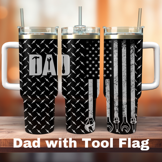 Two 40 oz tumblers with laser engraved designs, one depicting an American flag and the other with a tool-themed graphic, both with the text 'DAD WITH TOOL FLAG'.