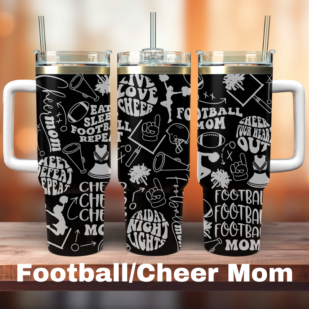 Three 40 oz black tumblers with white text and graphics related to football and cheerleading, each with a straw, displayed on a wooden surface with the text 'FOOTBALL/CHEER MOM' at the bottom.