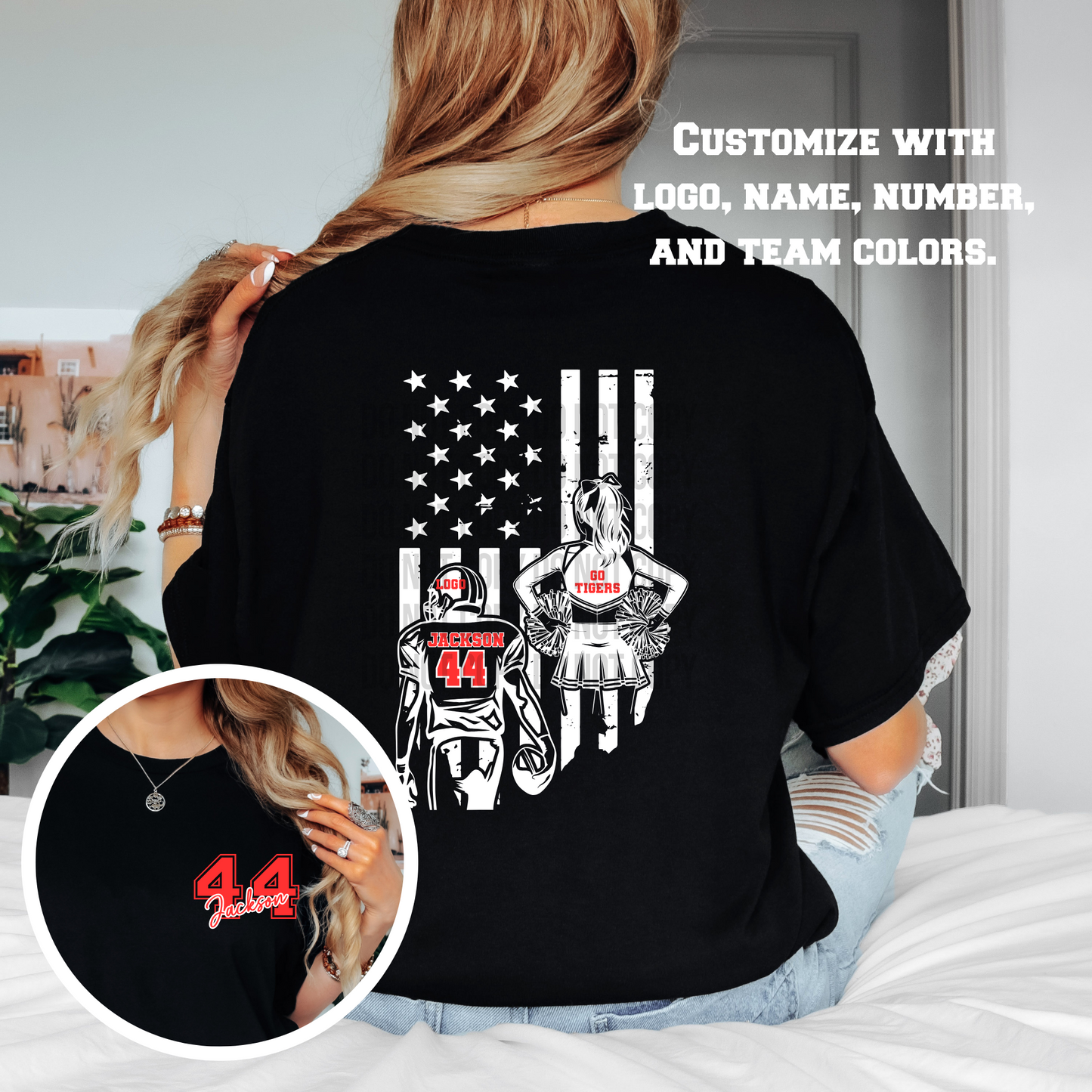 Person wearing a black t-shirt with a graphic design, including a flag and sports-themed elements, in a casual indoor setting.