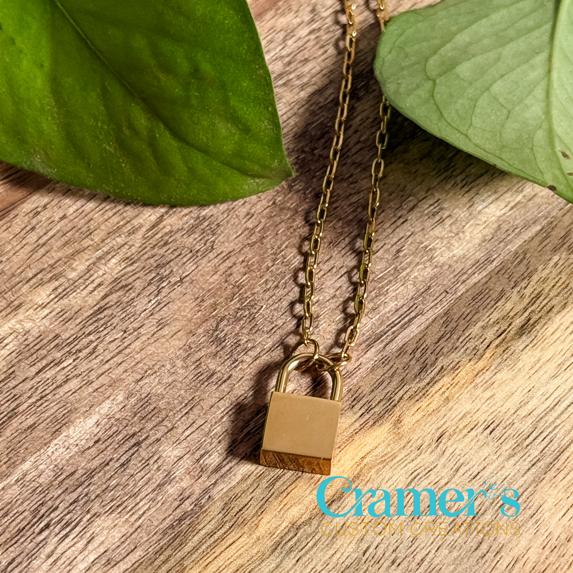 gold lock pendant on a wood background