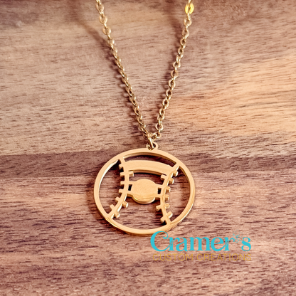 Gold necklace with a baseball or softball pendant on a wooden surface, featuring the 'Cramer's Custom Creations' logo.