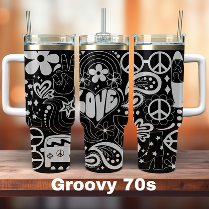 A set of three black and white Groovy 70s themed tumblers with various designs including flowers, hearts, and the word 'GROOVY'.