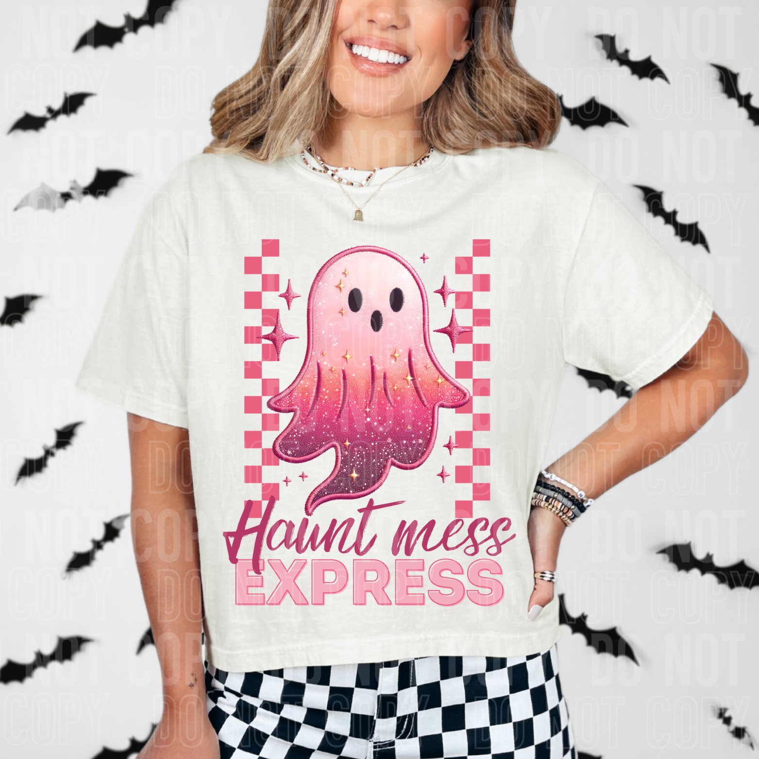 pink checked with a sparkly ghost says haunt mess express