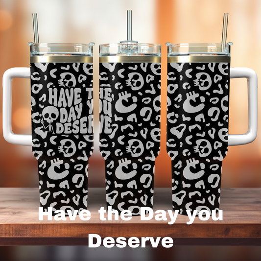 three 40oz black tumblers with have the day you deserve with leopard print all around it