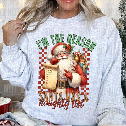 Sweatshirt showing a design with santa with a list saying im the reason santa has a naughty list