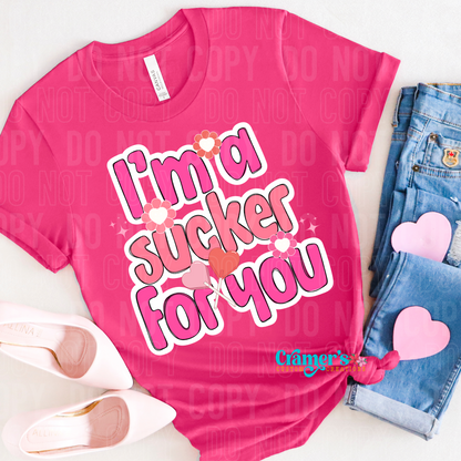 pink tshirt in a flat lay presentation with the words I'm a sucker for you