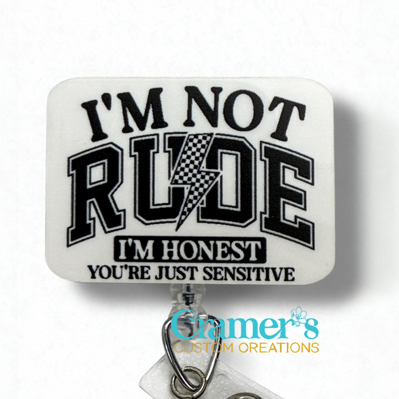 white badge toppper with black text 'I'm not rude, I'm honest, you're just sensitive' and Cramer's Custom Creations logo.