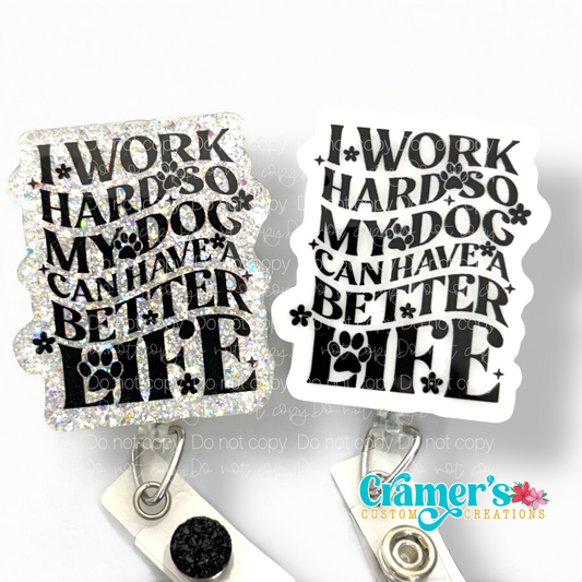 two badge reels one plain, one glitter both white with black writing that says I work hard so my dog can have a better life