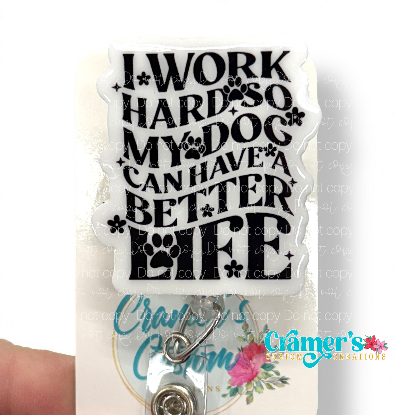 badge reel no glitter white with black writing that says I work hard so my dog can have a better life