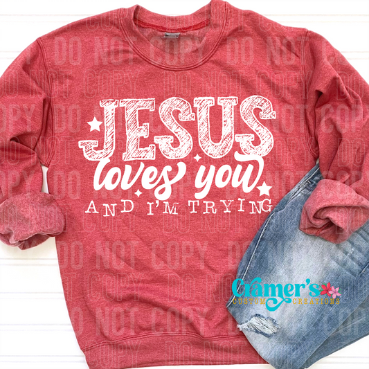 flat lay of a red sweatshirt that says jesus loves you and i'm trying