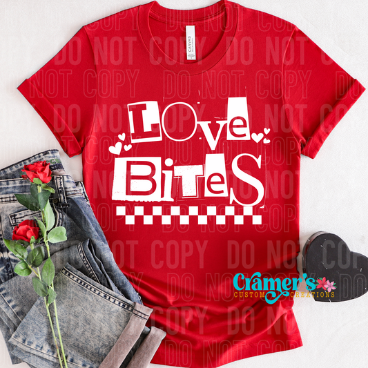 flat lay with a red shirt that says love bites