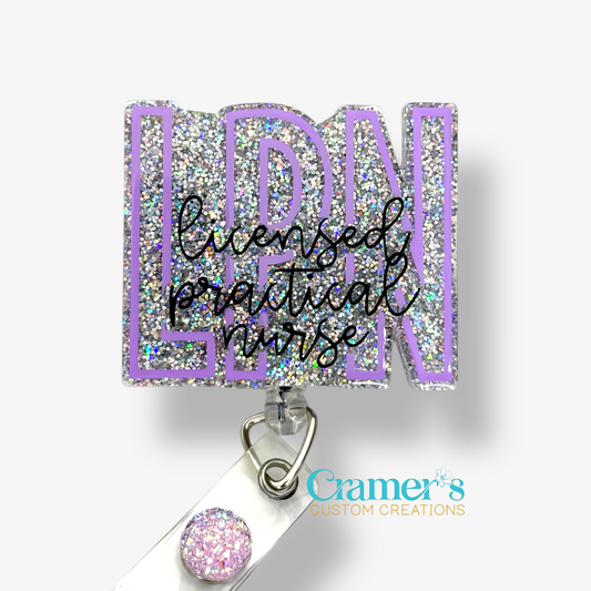 badge reel showing a silver glitter background with the initials in purple and licensed practical nurse in black
