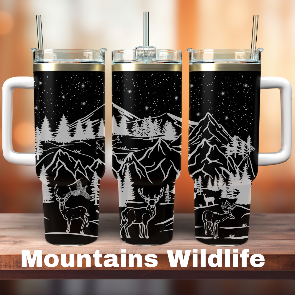three 40oz black tumblers with mountain and wildlife designs on it.