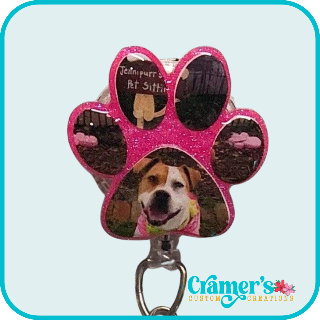 pink glitter paw print shape with a photo of a dog