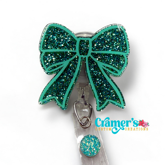 Glittery Bow badge reel in teal colors