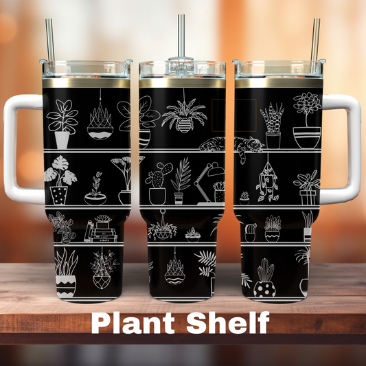 Three black 40 oz tumblers with white laser engraved plant shelves, displayed on a wooden surface with plant illustrations.