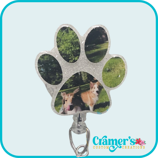 white glitter paw print with a photo of a dog on it