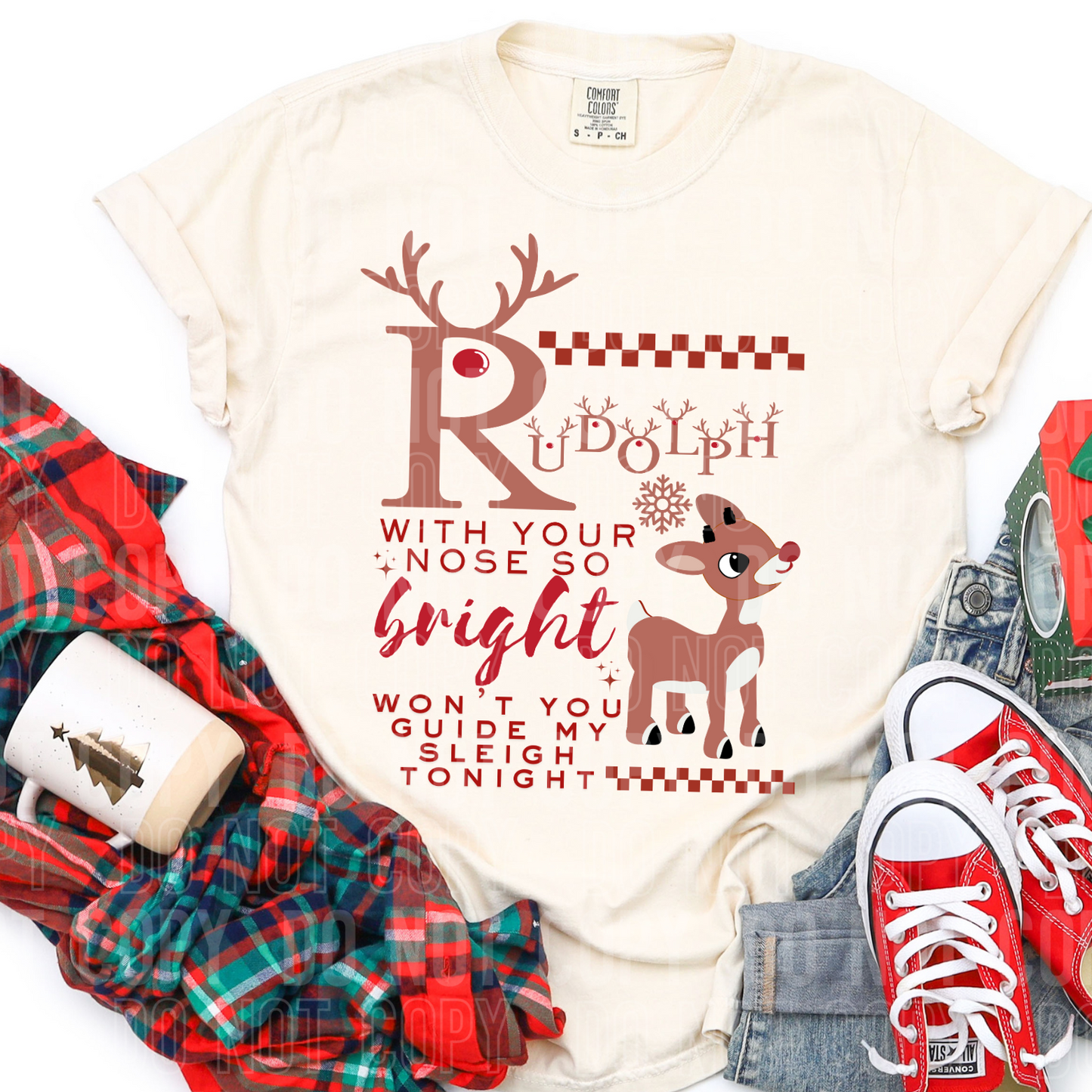 a shirt with rudolph on it and it says rudolph with your nose so bright