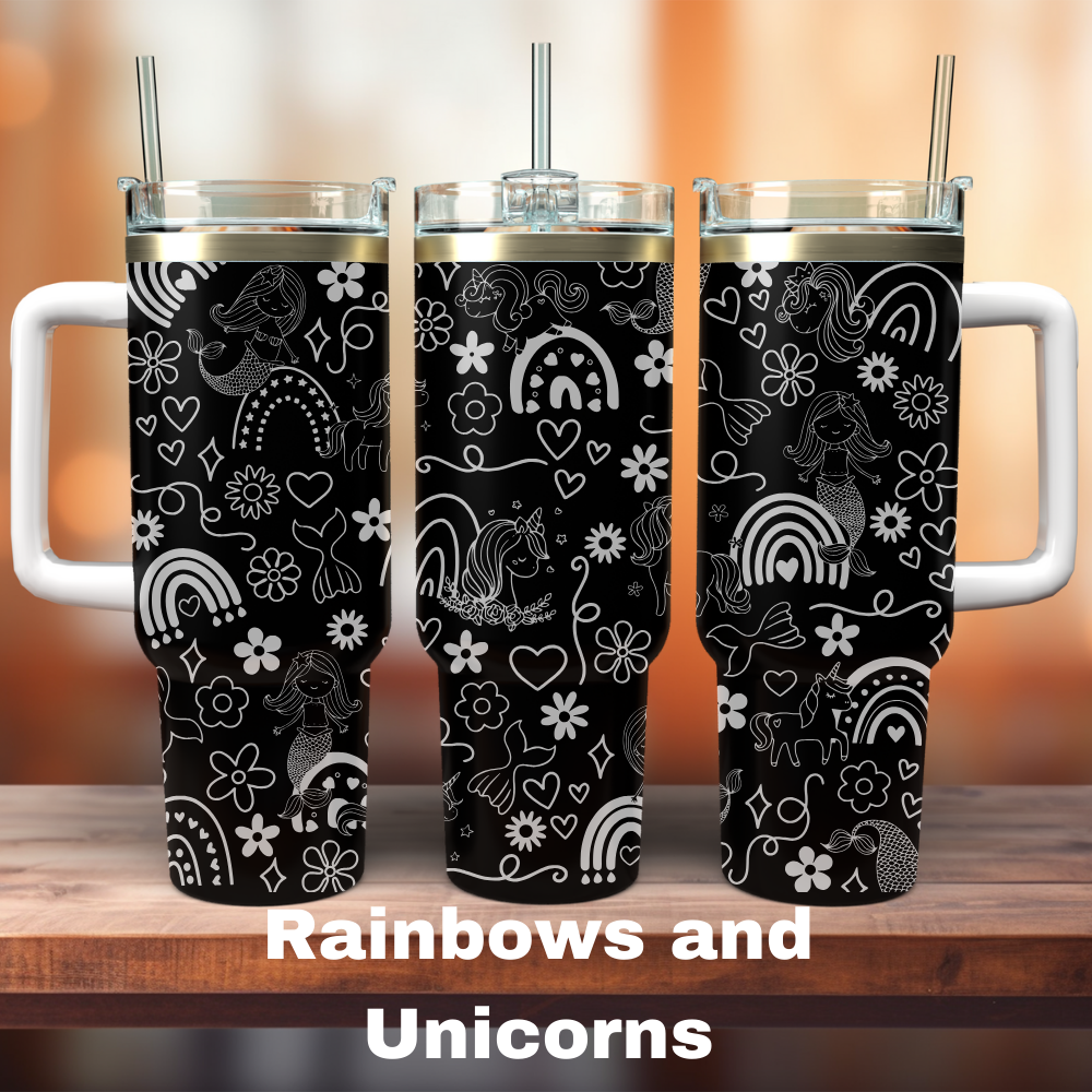 Three black 40 oz tumblers with white handles and laser engraved designs of rainbows and unicorns.