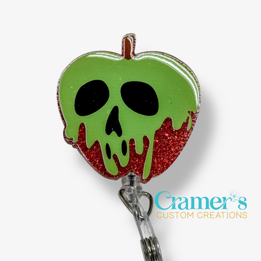 Green apple-shaped badge holder with skull design on a white background, featuring 'Cramer's Custom Creations' branding.
