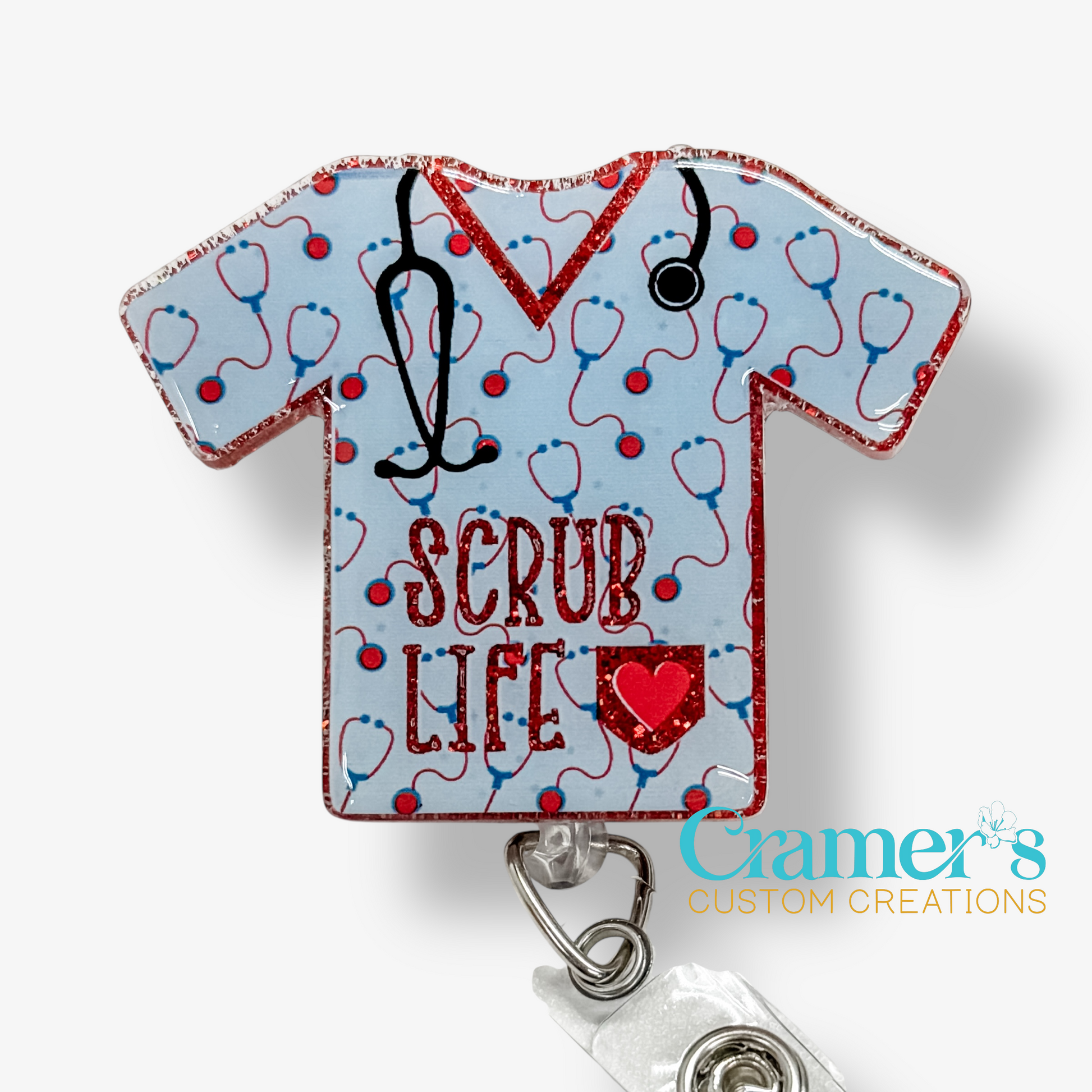 Badge holder shaped like a scrub top with 'SCRUB LIFE' text and stethoscope design on a light blue background.