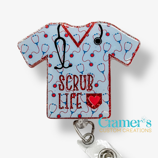 Badge holder shaped like a scrub top with 'SCRUB LIFE' text and stethoscope design on a light blue background.