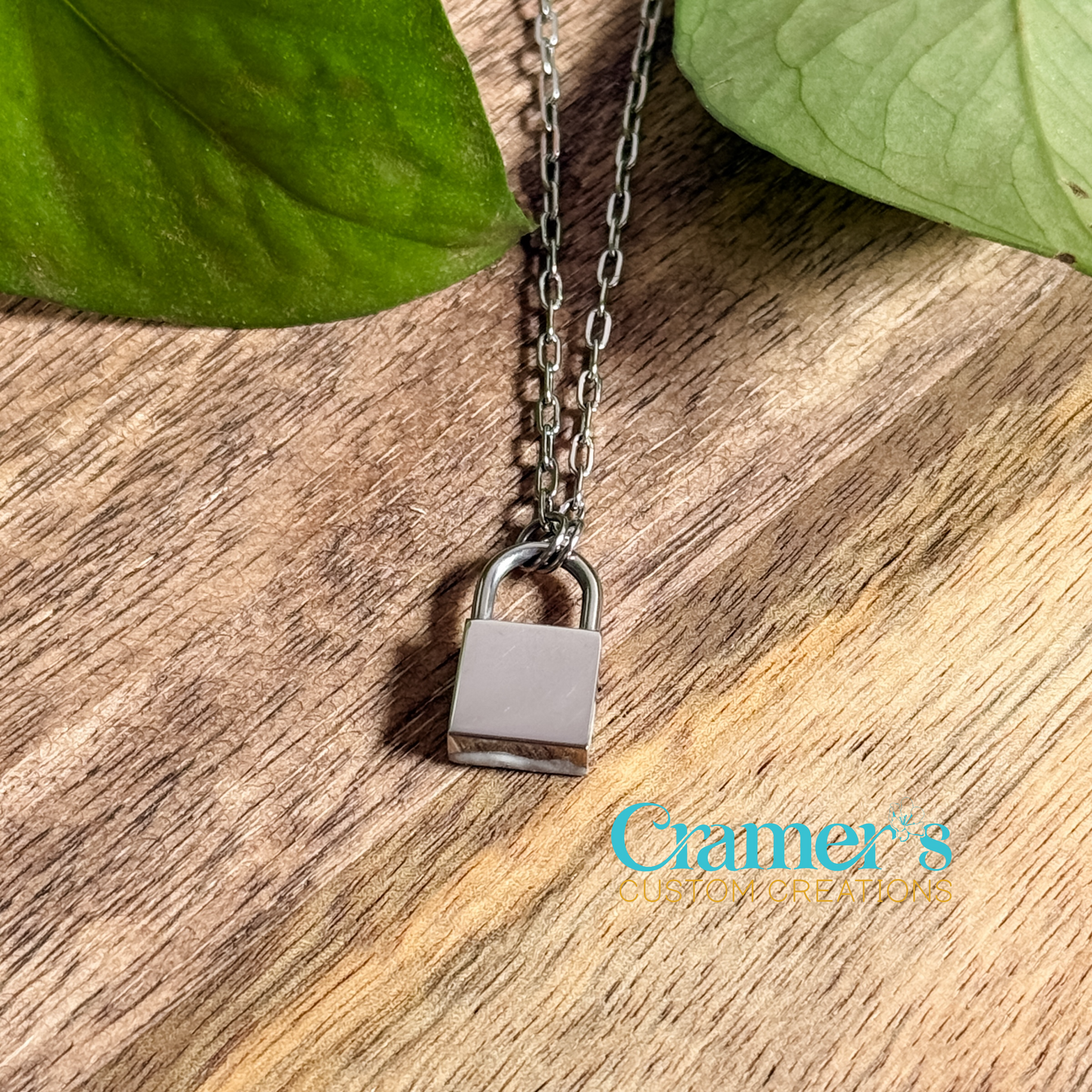 silver lock necklace on a wooden background