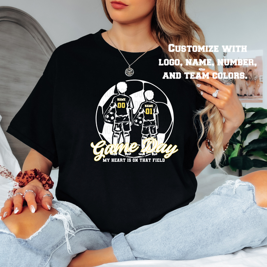 Person wearing a black t-shirt with sports-themed design and text.