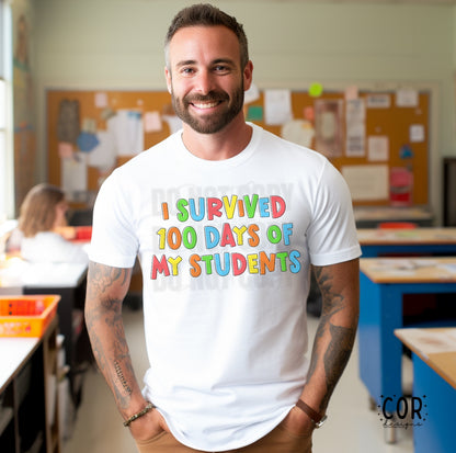 man standing in a classroom with a white tshirt that says I survived 100 days of my students