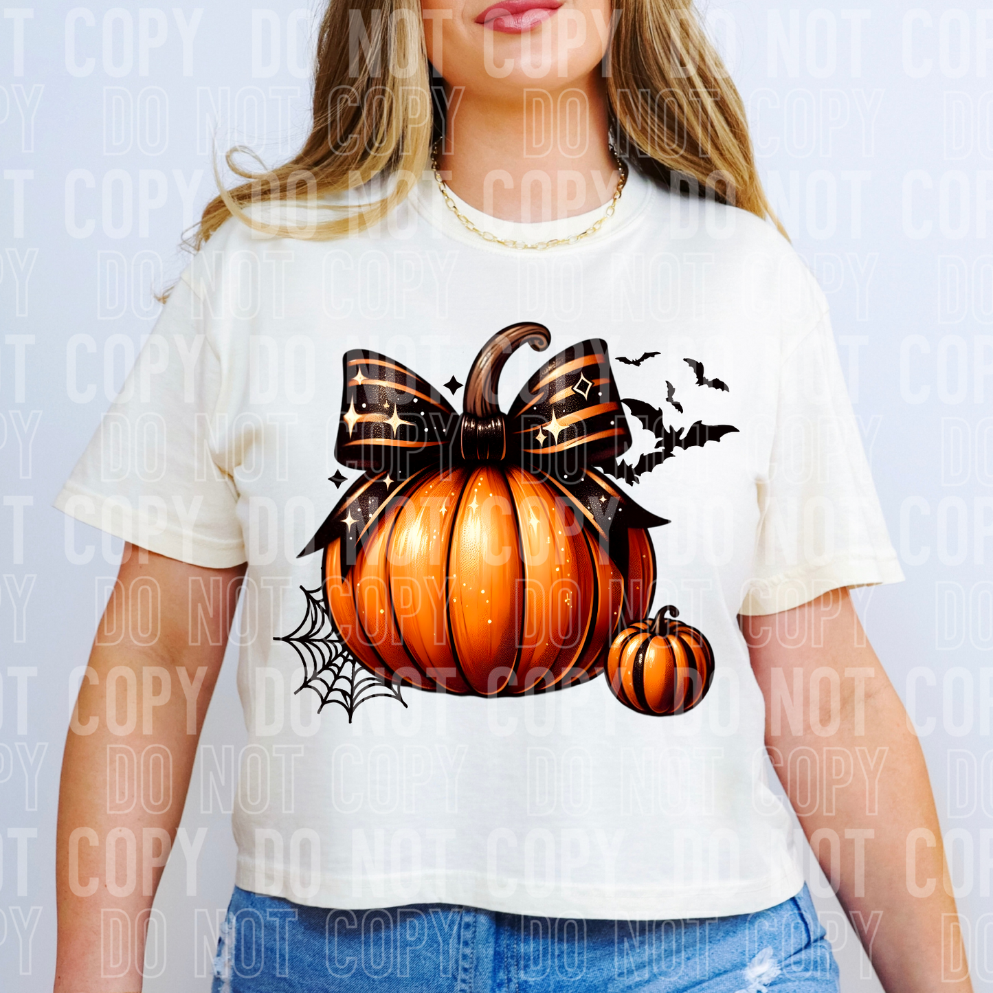 a vintage pumpkin with a bow on a shirt