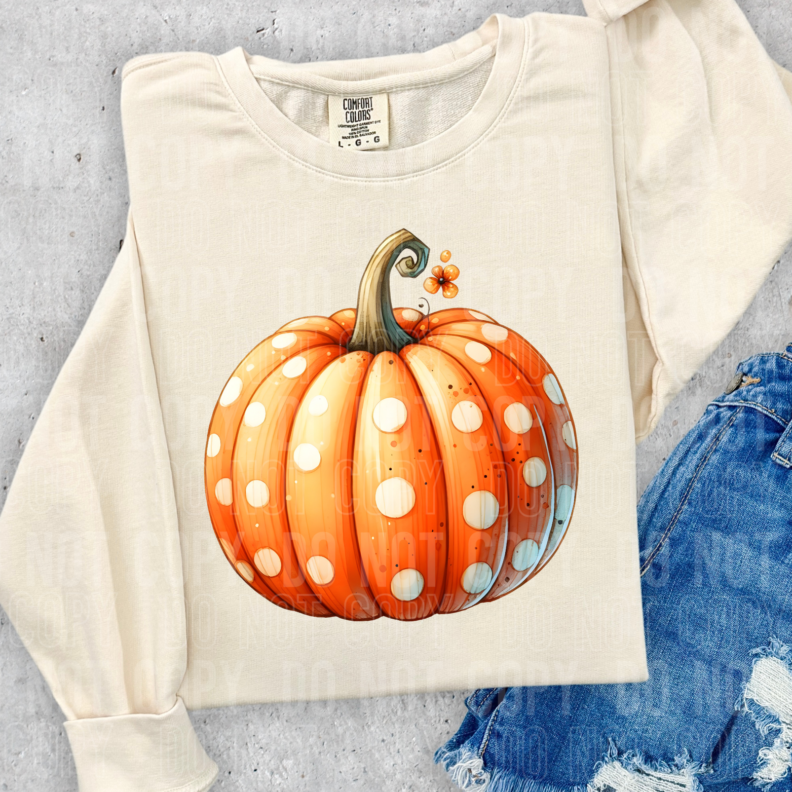 shirt showing a watercolor pumpkin with polka dots