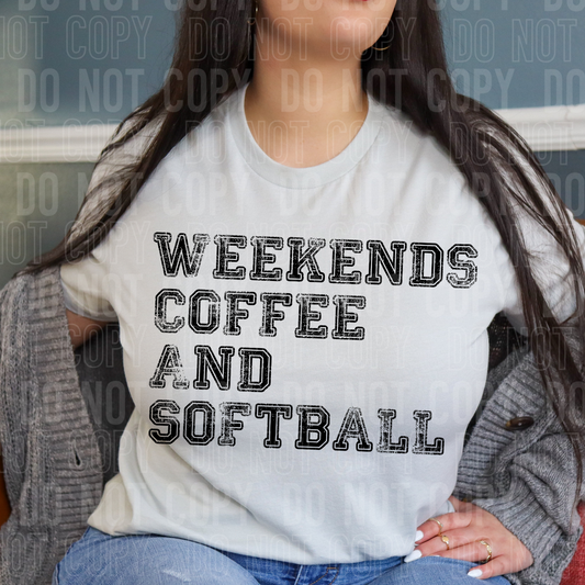 A person wearing a light-colored t-shirt with the text 'WEEKENDS COFFEE AND SOFTBALL' printed on the front.