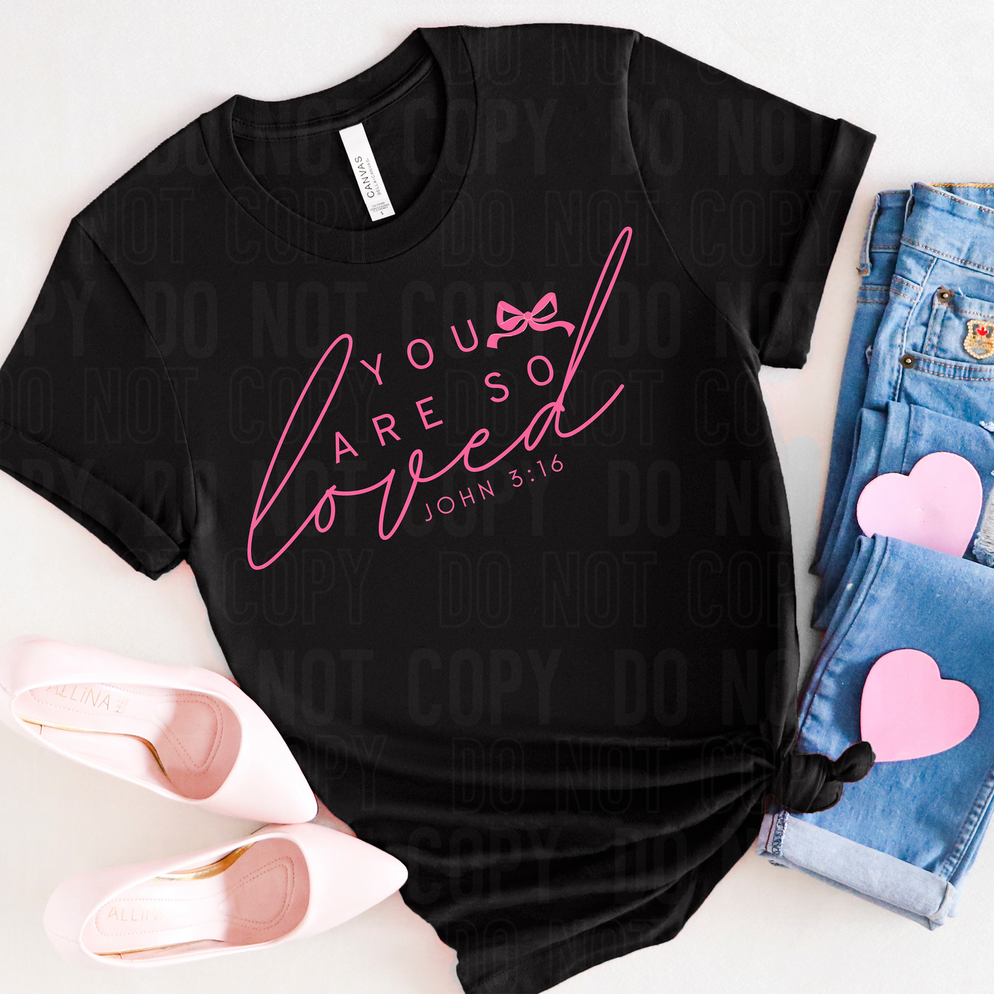 Black shirt laying flat that says you are so loved john 3:16 in hot pink