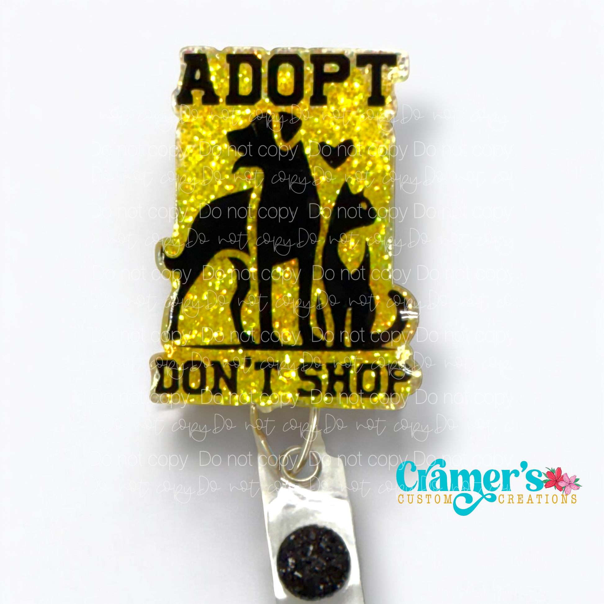badge reel showing a yellow glitter background with adopt don't shop and a dog and a cat