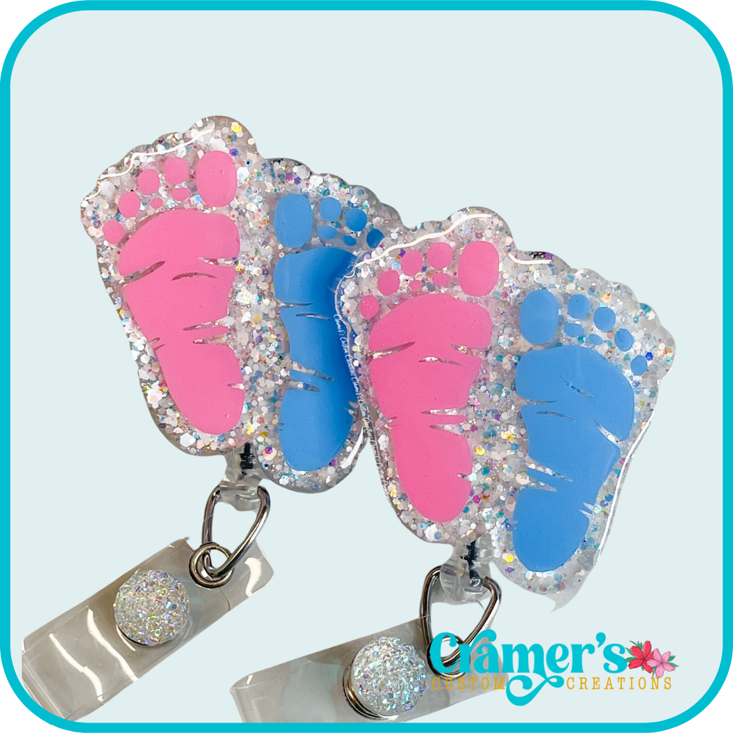 badge reel with pink and blue footprints