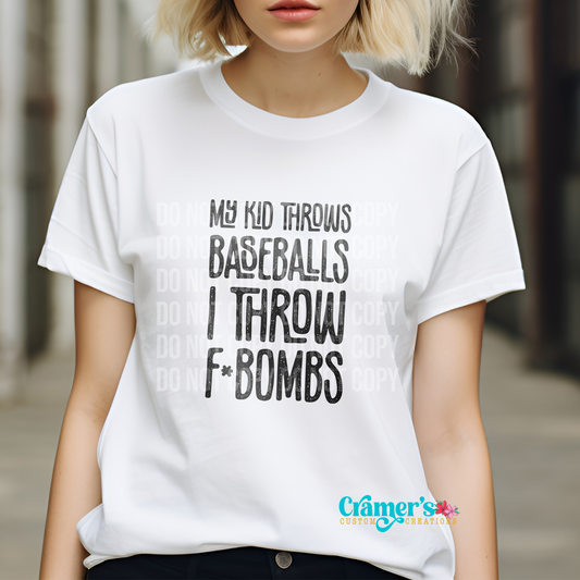A person wearing a white t-shirt with black text that reads 'MY KID THROWS FBombs I THROW BASEBALLS'.