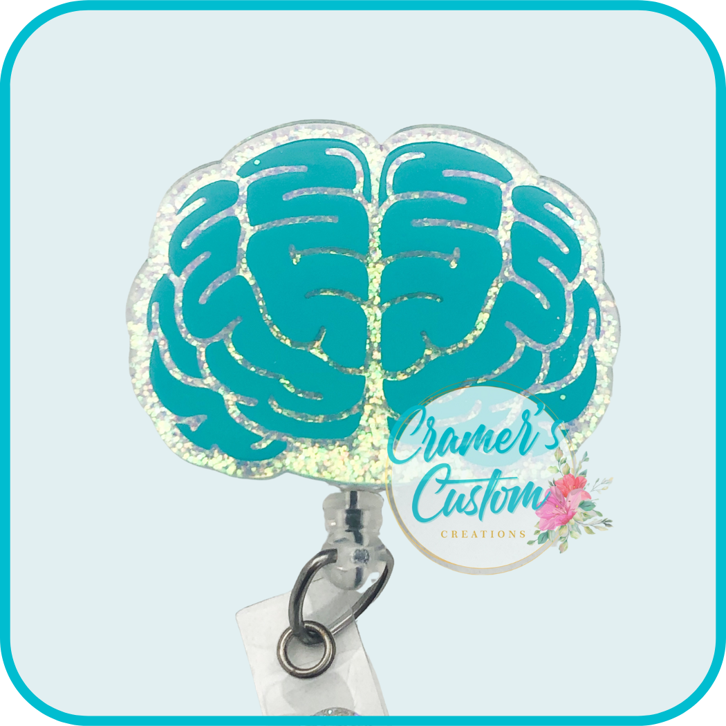 brain badge reel with teal vinyl and white glitter