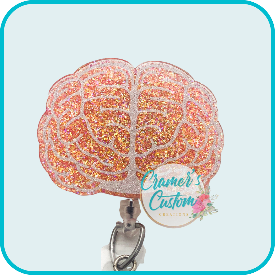 brain badge reel with silver vinyl and peach glitter