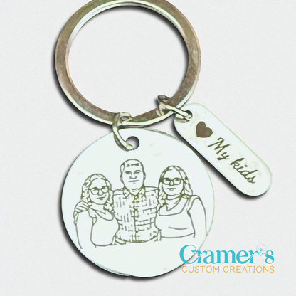 Keychain with engraved family photo and 'My kids' tag on a light background