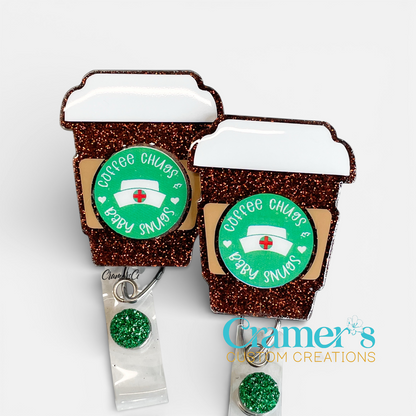 coffee cup badge with brown glitter and a decal that says coffee chugs and baby snugs