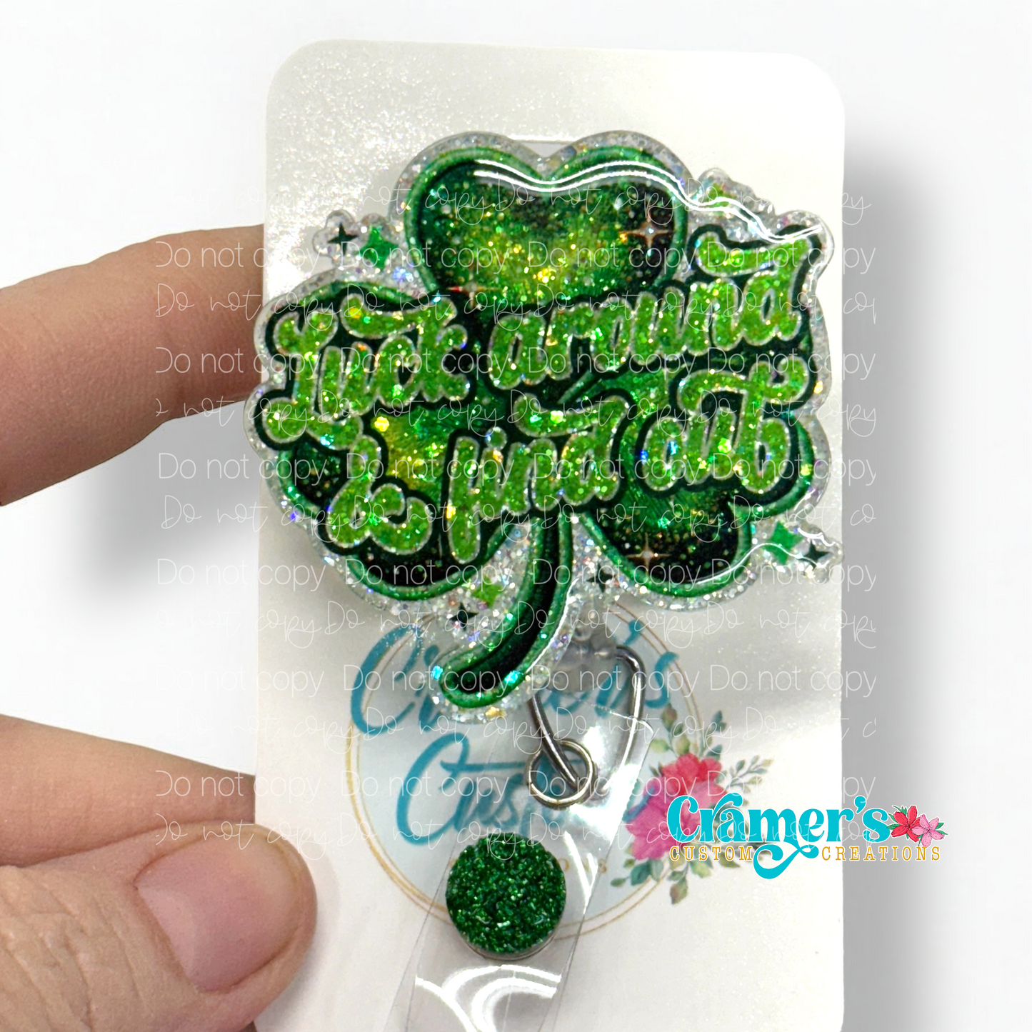 badge reel showing a glitter option of a shamrock that says luck around and find out