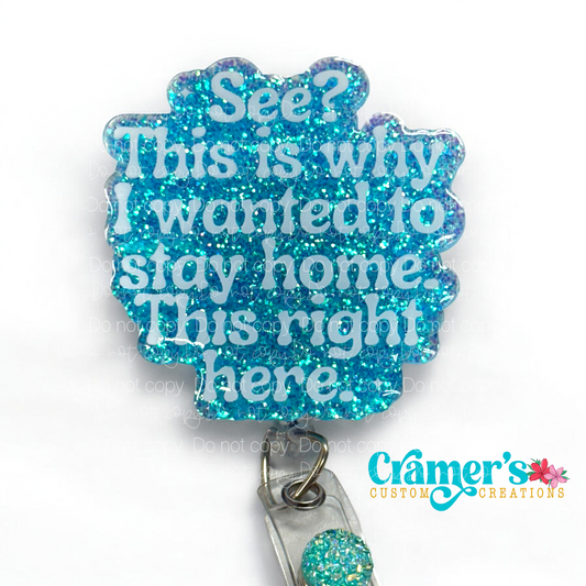 flat lay of blue glitter badge reel with see? this is why I wanted to stay home. this right here in white